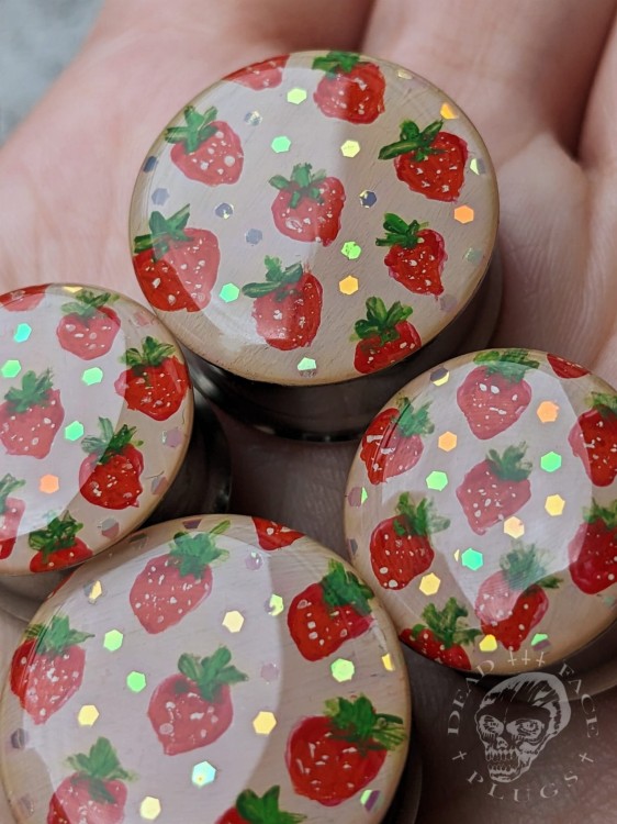 Artistic ear plugs with hand-painted fruits and rainbow sparkle