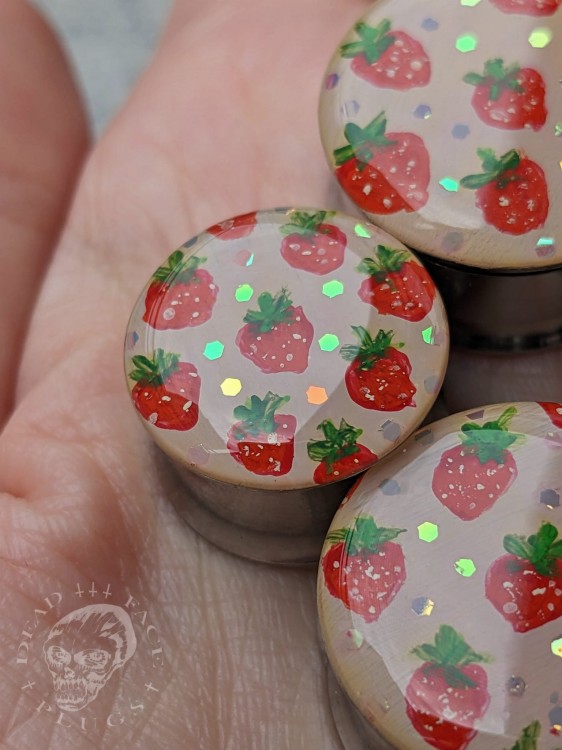 Artistic ear plugs with hand-painted fruits and rainbow sparkle