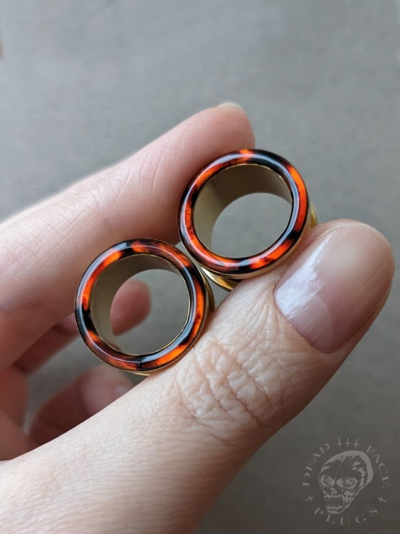 Handmade surgical steel ear plugs with brown and orange tortoiseshell resin