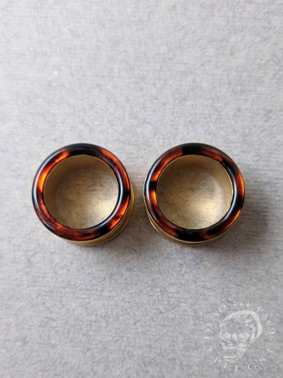 Handmade surgical steel ear plugs with brown and orange tortoiseshell resin