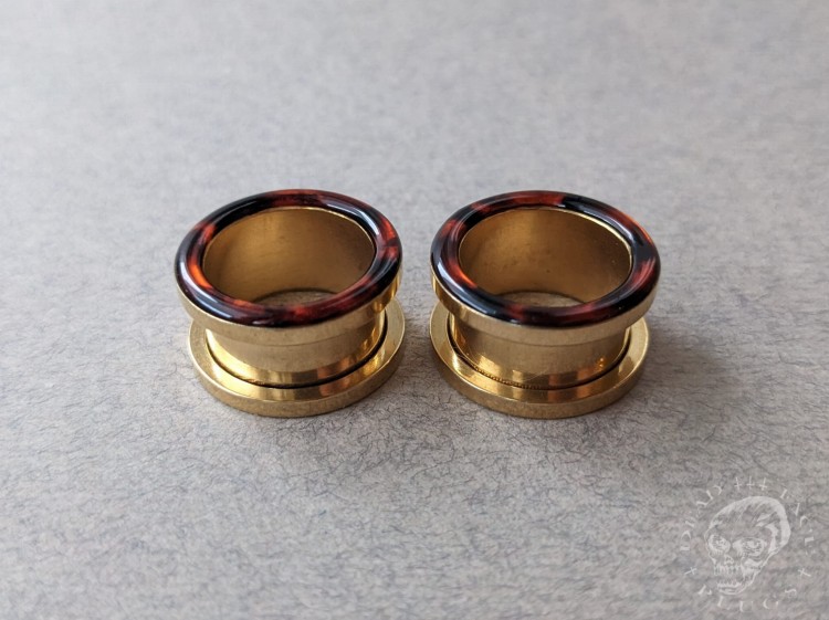 Handmade surgical steel ear plugs with brown and orange tortoiseshell resin