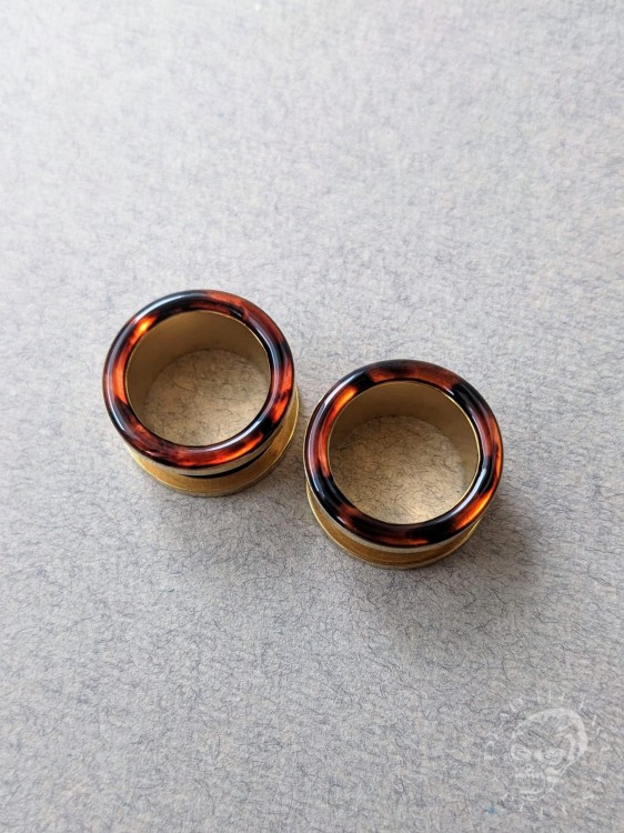 Handmade surgical steel ear plugs with brown and orange tortoiseshell resin
