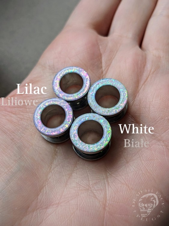 Magically opalescent ear plugs in surgical steel with lilac sparkles in pink, mint, gold, and green opalescent glitter