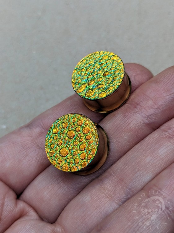 orange gold and green textured reptilian snake skin plugs gauges for stretched ears
