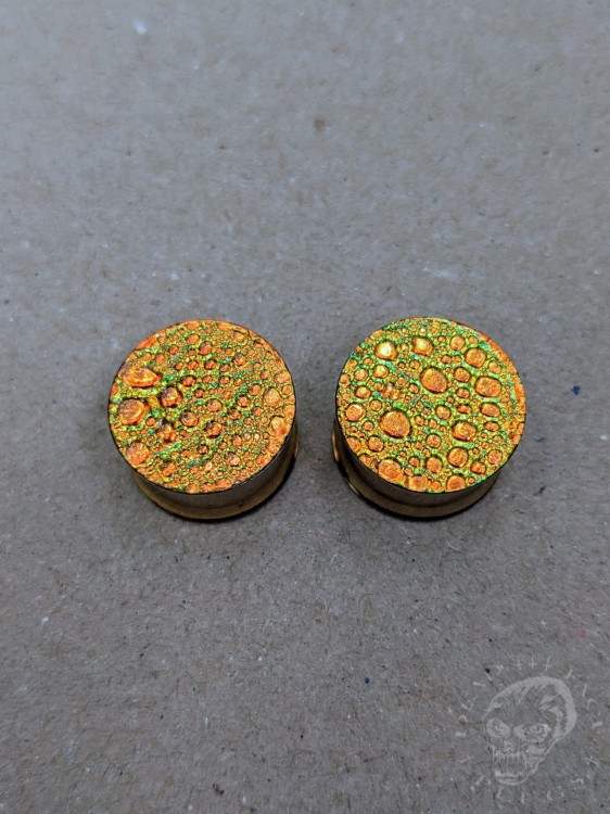 orange gold and green textured reptilian snake skin plugs gauges for stretched ears