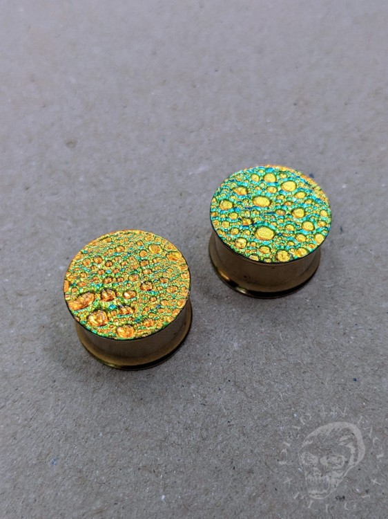 orange gold and green textured reptilian snake skin plugs gauges for stretched ears