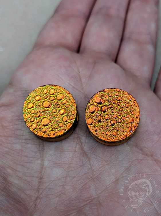orange gold and green textured reptilian snake skin plugs gauges for stretched ears