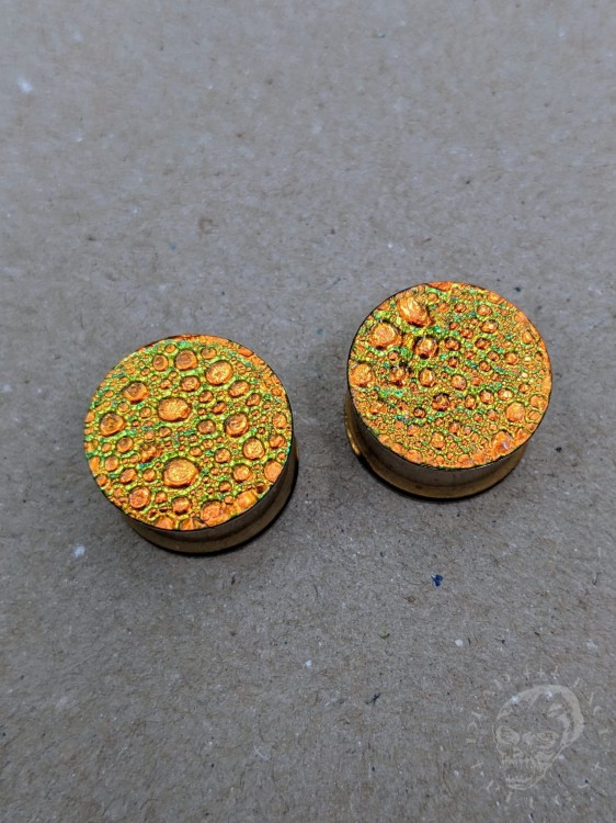 orange gold and green textured reptilian snake skin plugs gauges for stretched ears
