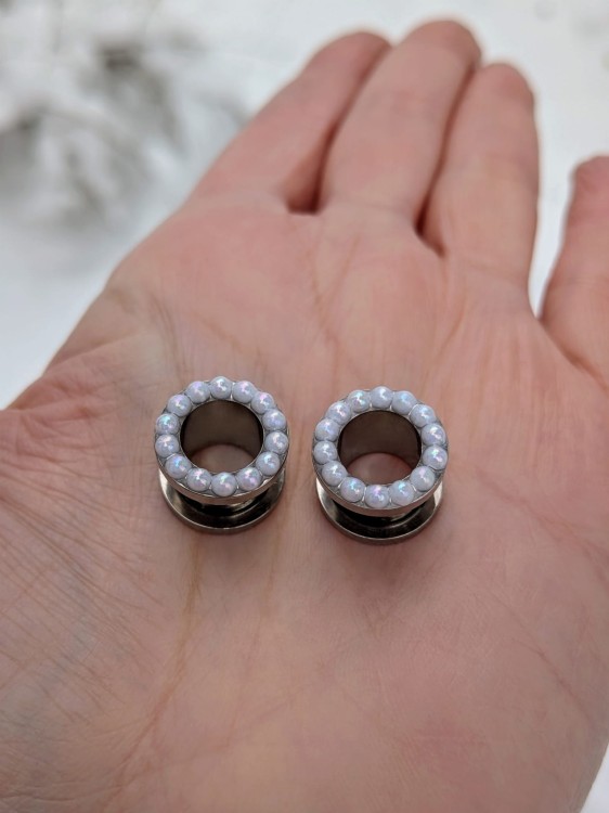 Stainless steel ear tunnels with tiny pearls and soft shimmer