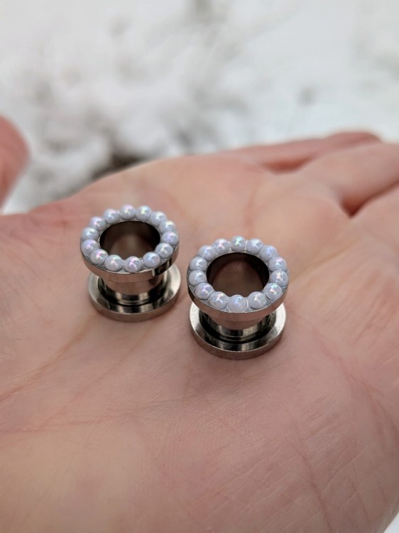 Stainless steel ear tunnels with tiny pearls and soft shimmer