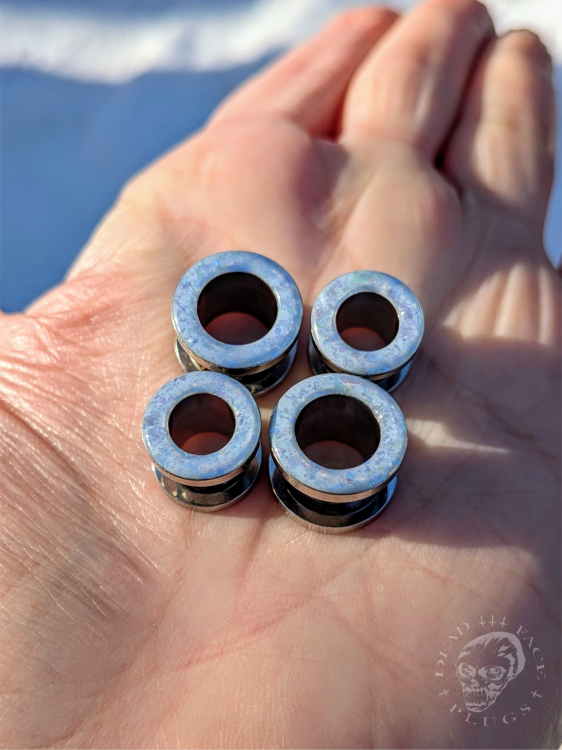 Ear tunnels with opalescent flakes in blue turquoise and green tones