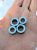 Ear tunnels with opalescent flakes in blue turquoise and green tones