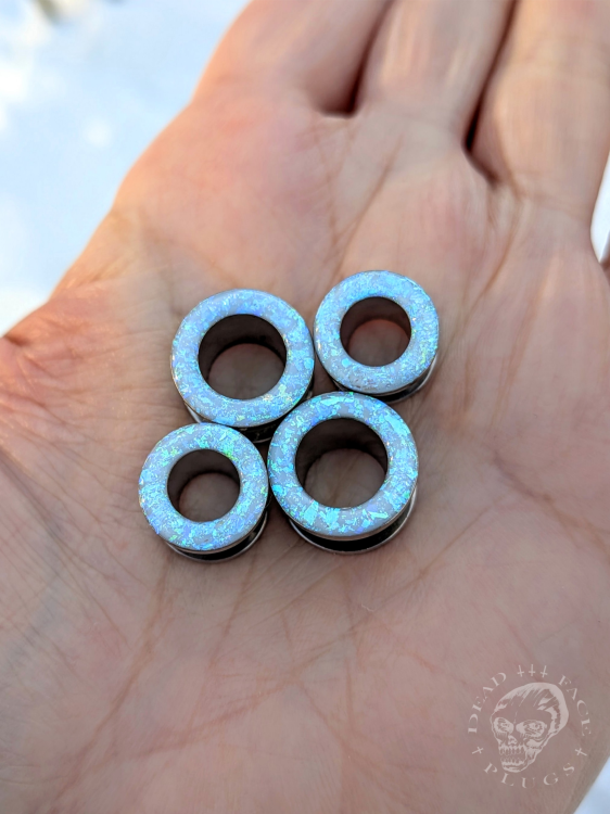 Ear tunnels with opalescent flakes in blue turquoise and green tones