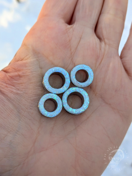 Ear tunnels with opalescent flakes in blue turquoise and green tones