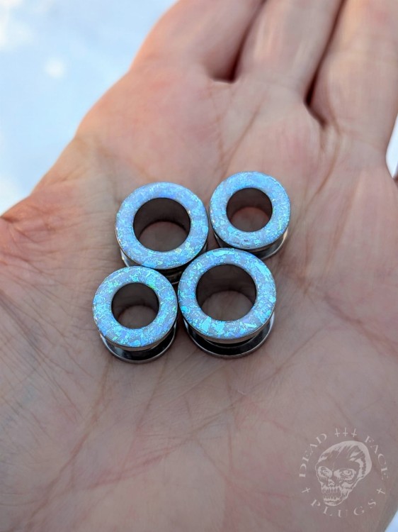 Ear tunnels with opalescent flakes in blue turquoise and green tones