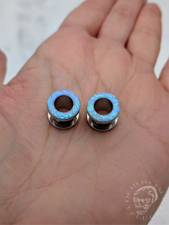 Ear tunnels with opalescent flakes in blue turquoise and green tones