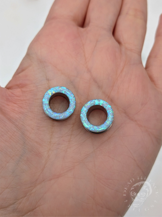 Ear tunnels with opalescent flakes in blue turquoise and green tones